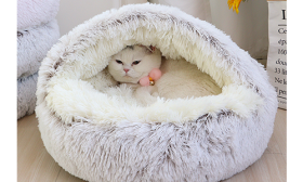 Slipper-shaped pet bed in grey with a fluffy interior, soft material, deluxe comfort and durable quality.
