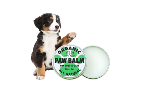 Green and white tin and box of organic, all-natural paw balm for dogs and cats, 60g, lick-safe formula.